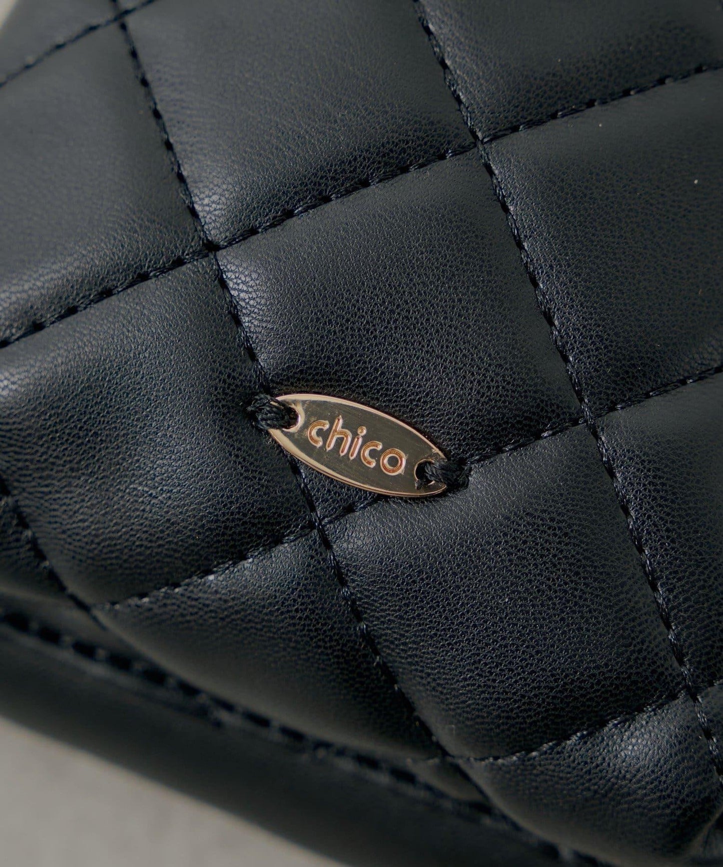 帶毛球掛飾絎縫手機包