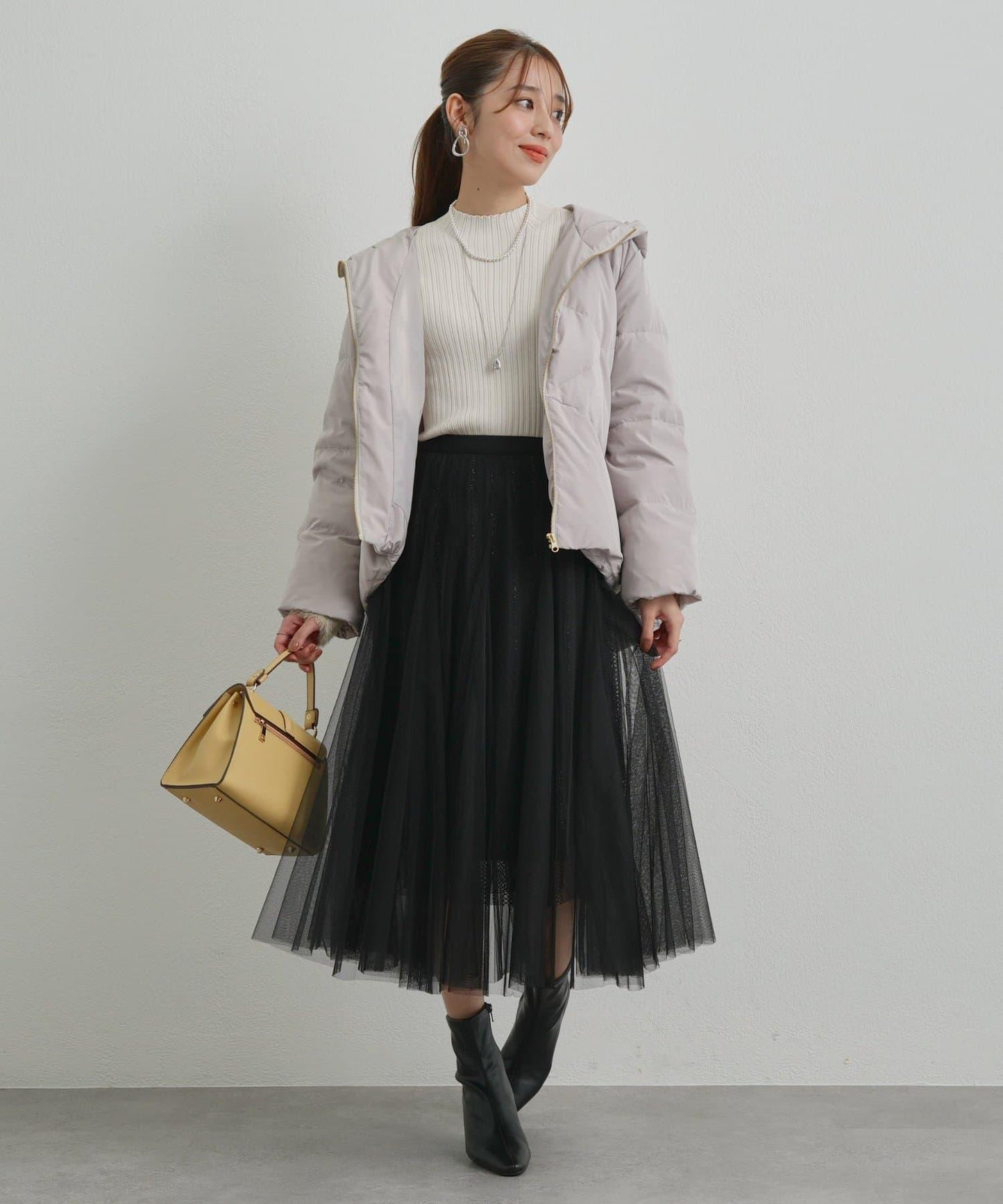 袖部毛絨拼接不規則羅紋針織衫