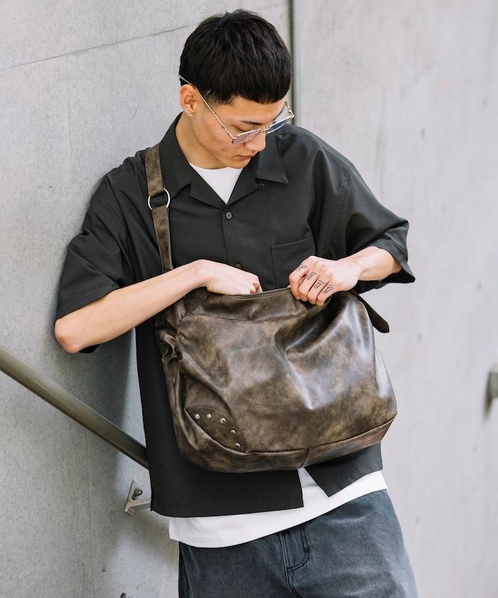 皮質圓形鉚釘肩揹包