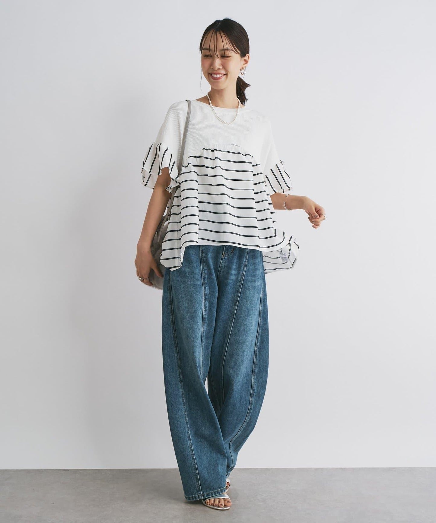 前片拼接弧形牛仔褲