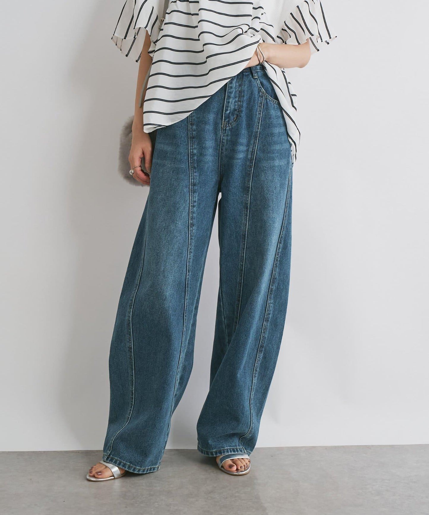 前片拼接弧形牛仔褲