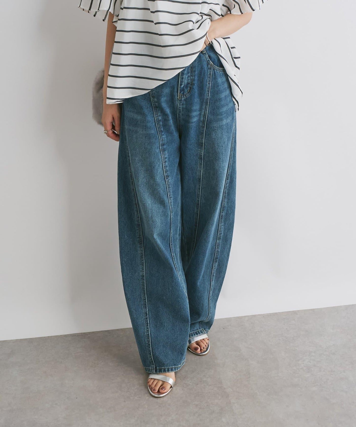 前片拼接弧形牛仔褲