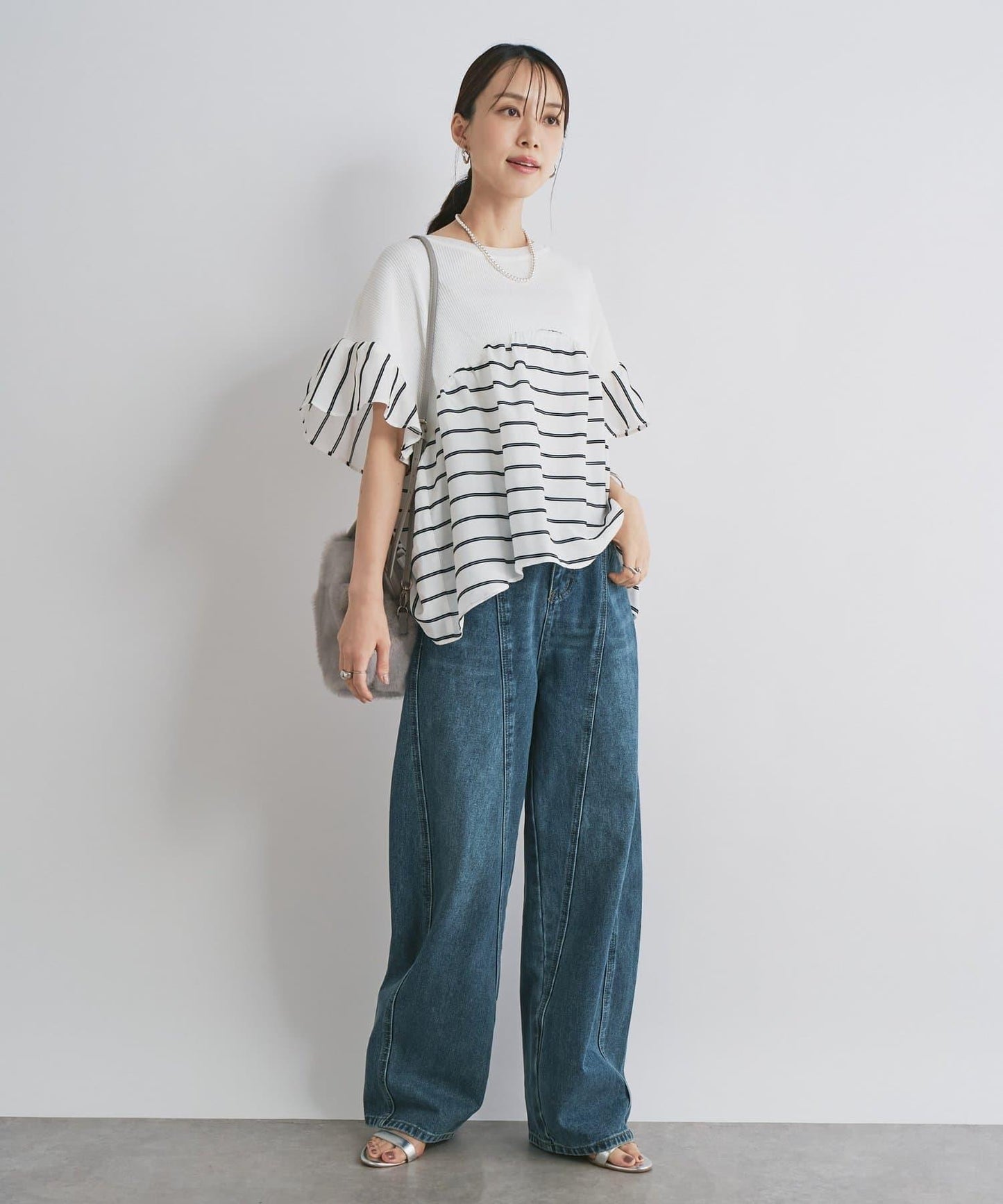 前片拼接弧形牛仔褲