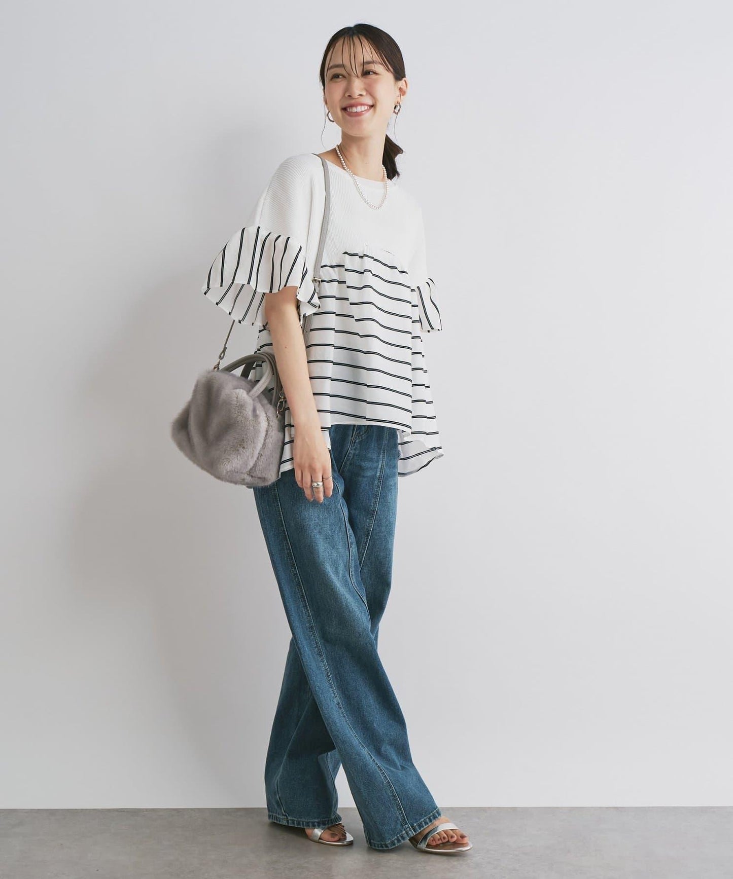 前片拼接弧形牛仔褲