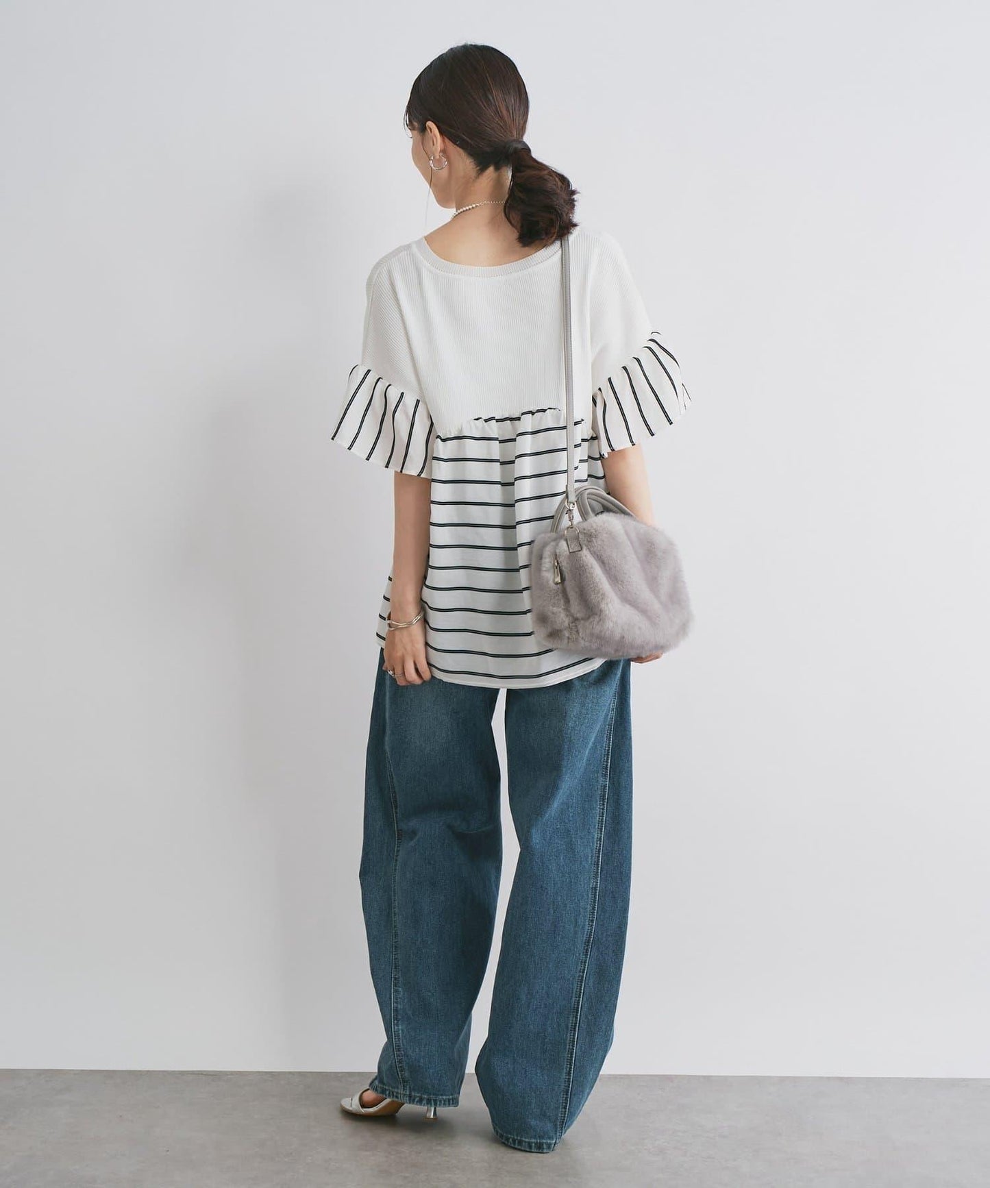 前片拼接弧形牛仔褲