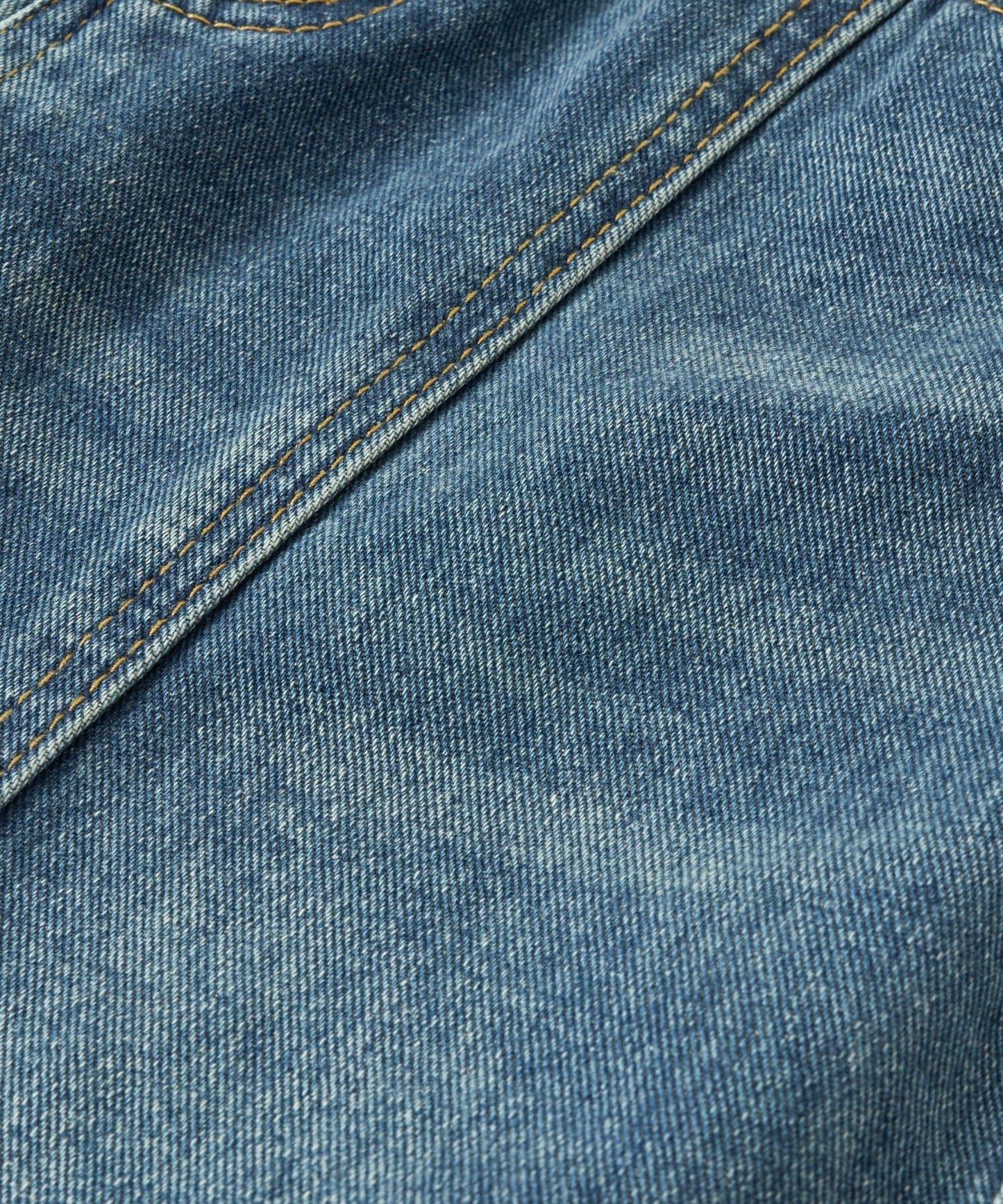 前片拼接弧形牛仔褲