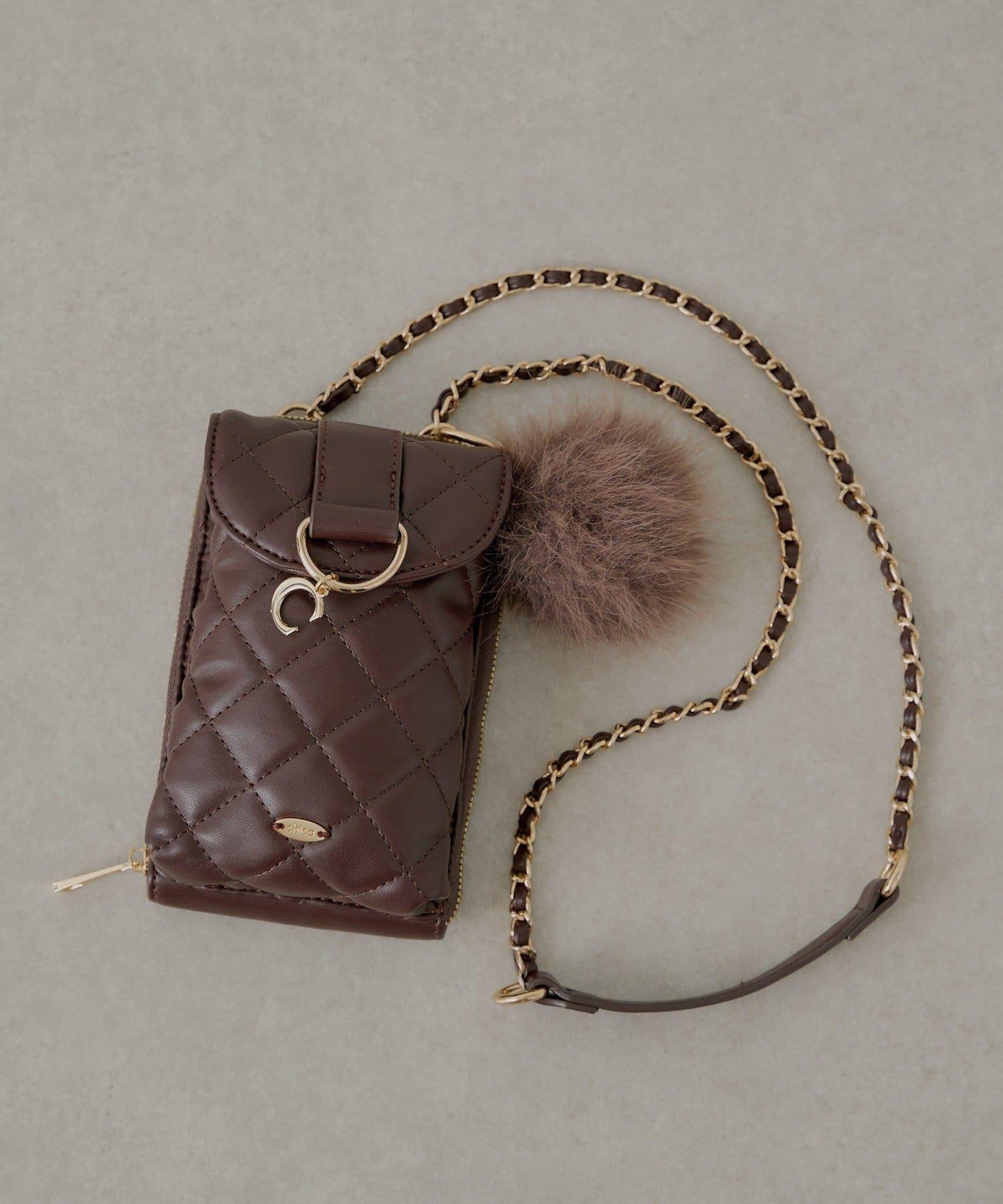 帶毛球掛飾絎縫手機包