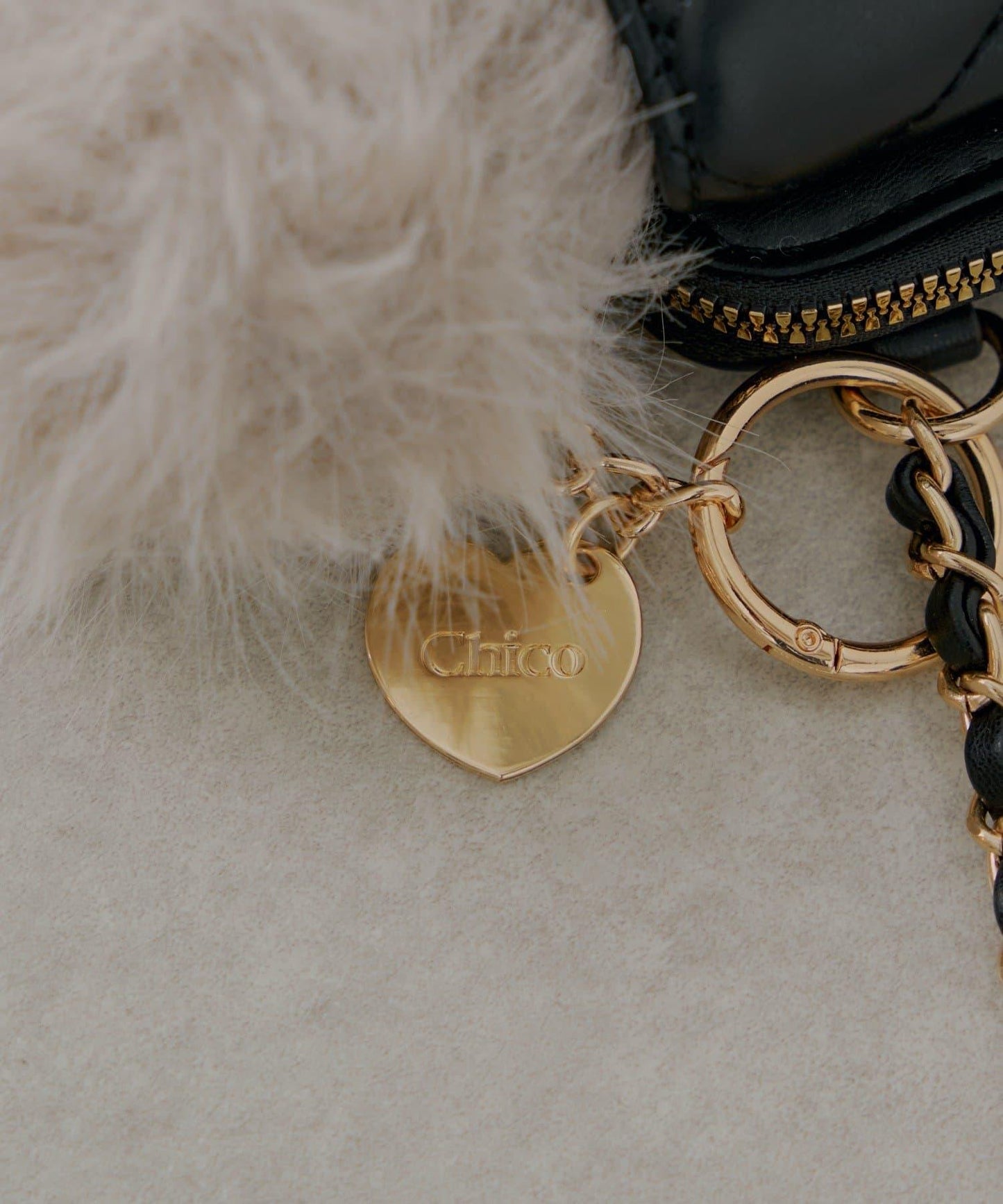 帶毛球掛飾絎縫手機包