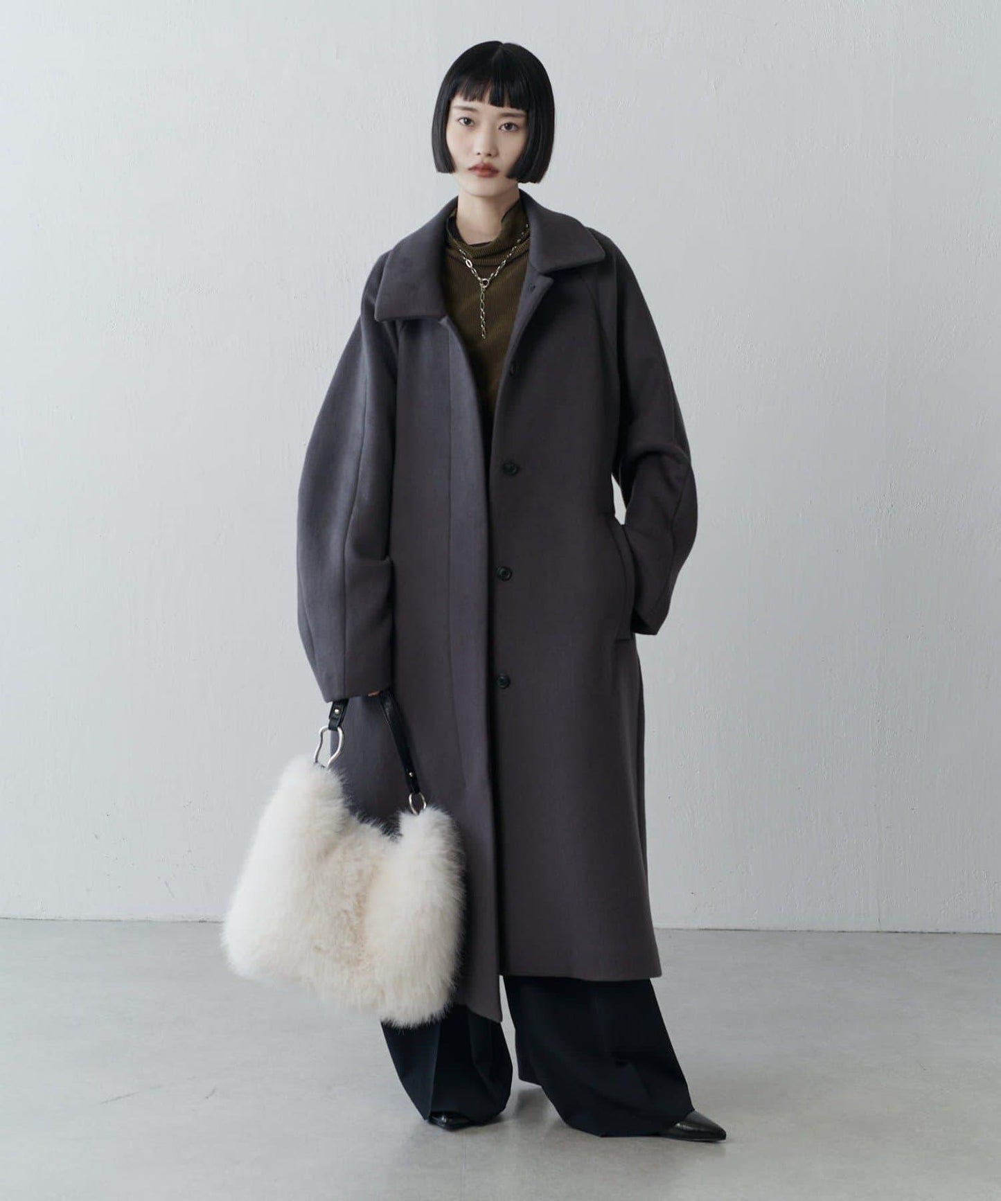 波浪扣皮革手柄毛絨揹包