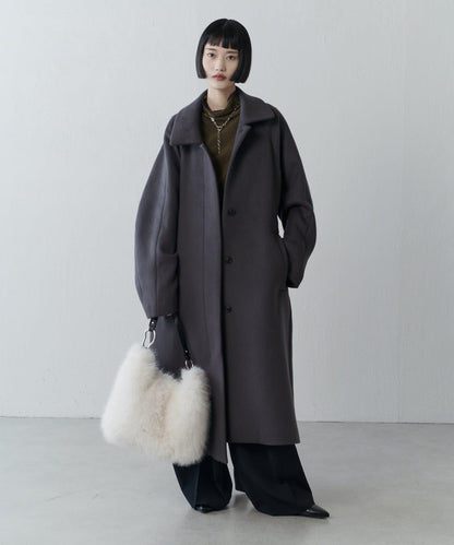 波浪扣皮革手柄毛絨揹包