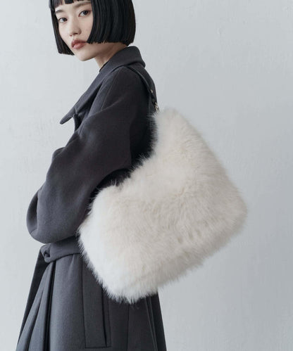 波浪扣皮革手柄毛絨揹包