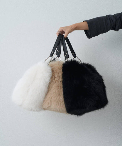 波浪扣皮革手柄毛絨揹包
