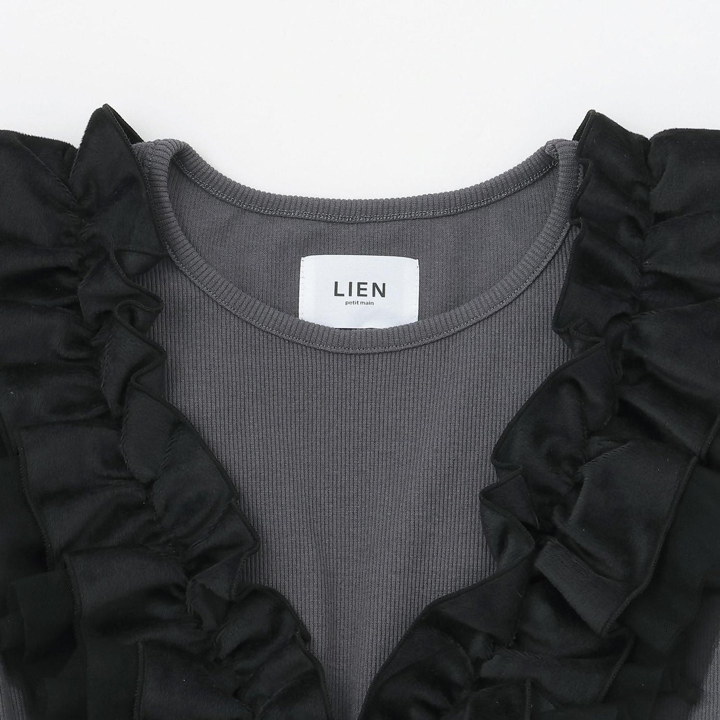 【リンク】拼接荷葉邊長款上衣