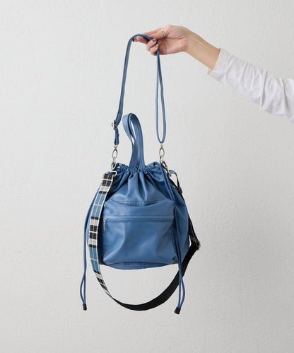 外口袋束口斜挎包