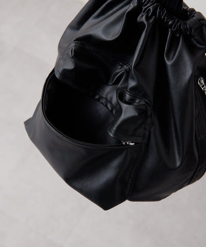 外口袋束口斜挎包