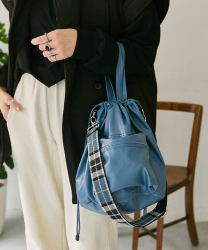 外口袋束口斜挎包