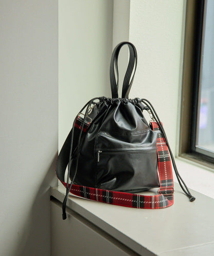 外口袋束口斜挎包