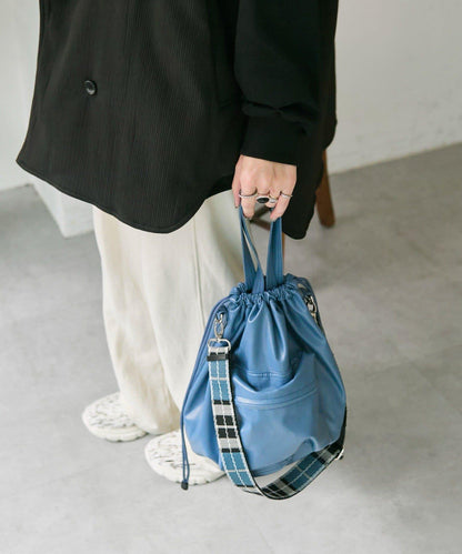 外口袋束口斜挎包