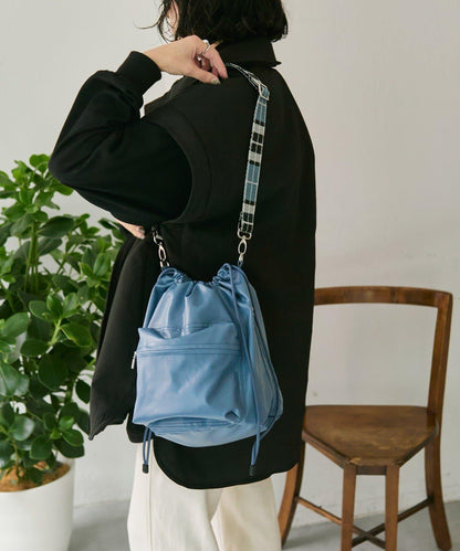外口袋束口斜挎包