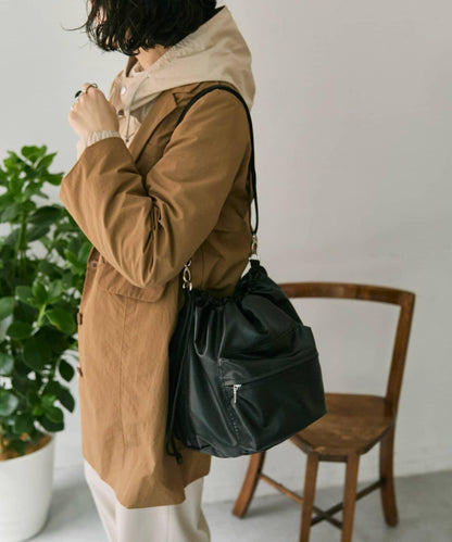 外口袋束口斜挎包