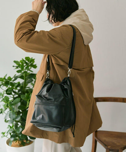 外口袋束口斜挎包