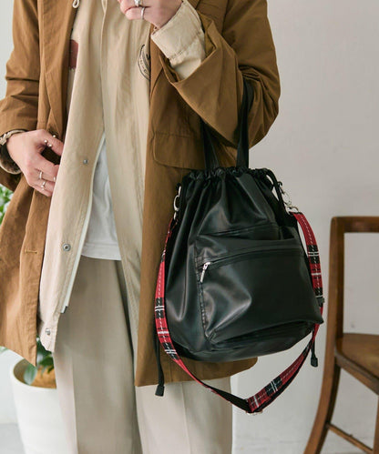 外口袋束口斜挎包