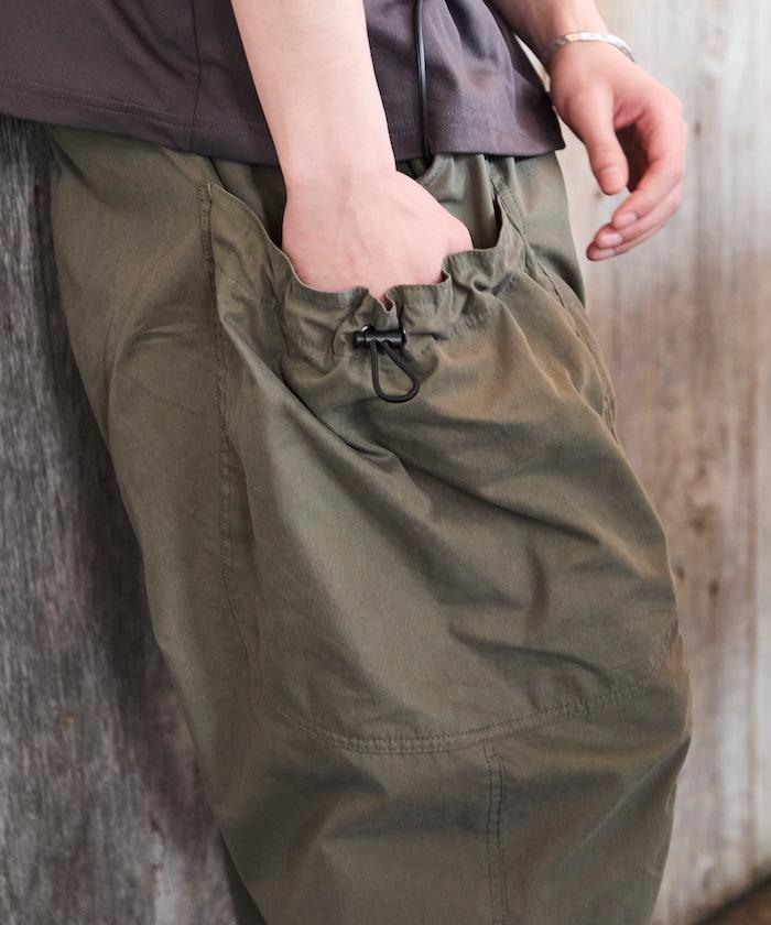 寬鬆彎刀版型 口袋抽繩設計 休閒工裝褲