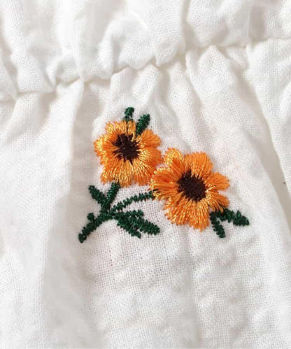 肩部荷葉邊拼接刺繡長款上衣