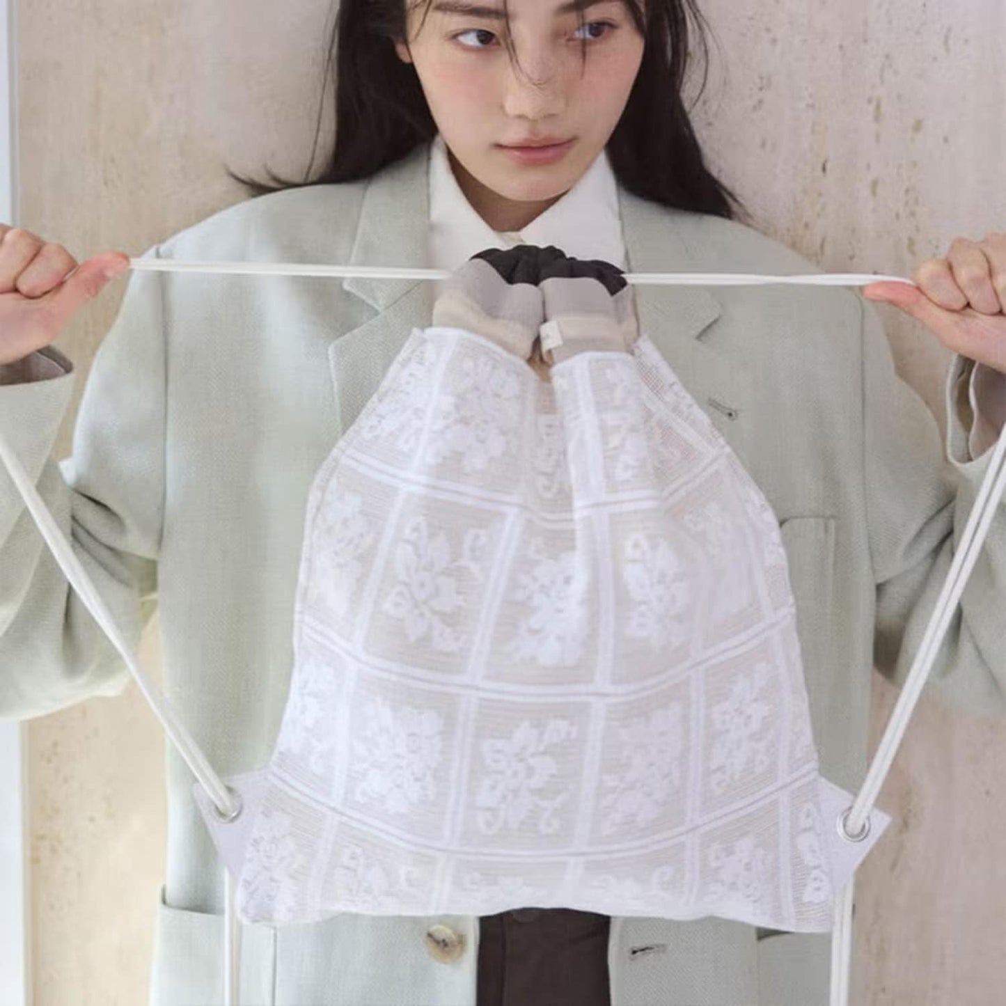 キャセリーニ 疊層蕾絲束口揹包