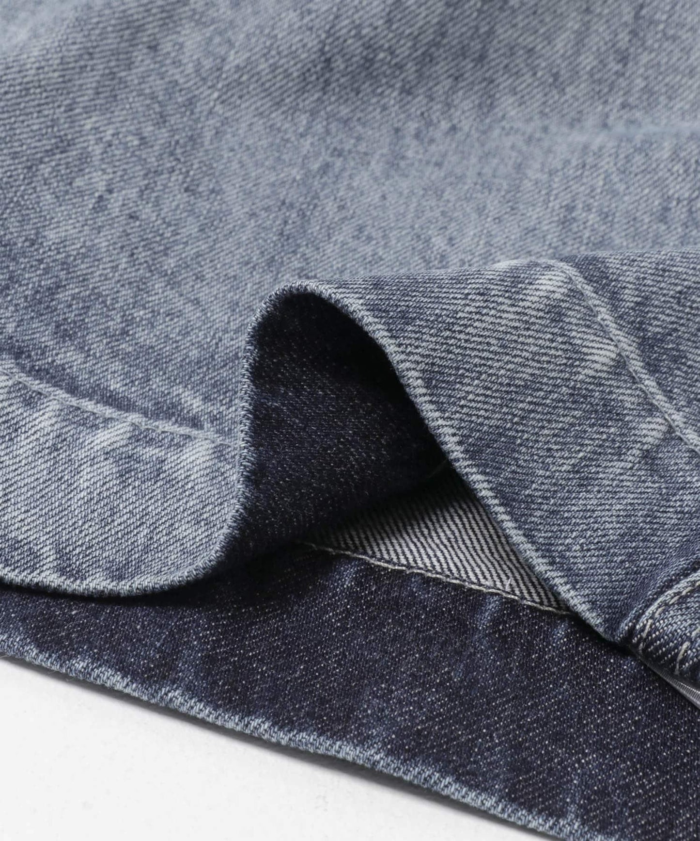 Nomat TWO-TONE DENIM CURVED PANTS
